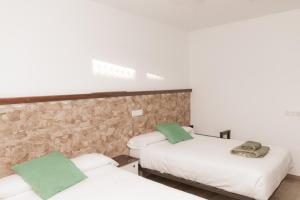 Postel nebo postele na pokoji v ubytování La Via Verde