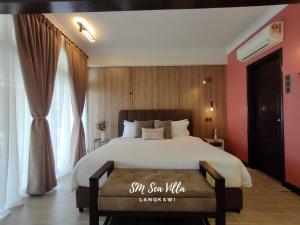 Postel nebo postele na pokoji v ubytování SM Sea Villa by Langkawi Lagoon Resort