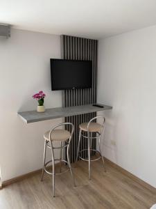 Телевизор и/или развлекательный центр в Camera Deluxe Pensiunea Liziera