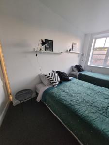 En eller flere senge i et værelse på Boutique hotel MEŅĢELES PIENOTAVA