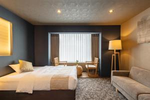 Ein Bett oder Betten in einem Zimmer der Unterkunft 谷町君Hotel 松竹雲 京都四条烏丸