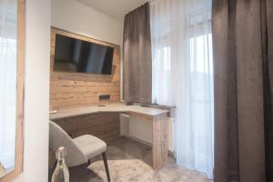 TV a/nebo společenská místnost v ubytování Hotel dasZimmermann