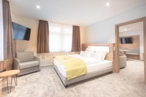 Postel nebo postele na pokoji v ubytování Hotel dasZimmermann
