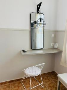 a chair sitting on a shelf in a room at Harmony Seaside Pelion in Platanias