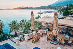 a view of a resort with tables and umbrellas at Aqua Princess Hotel in Kas
