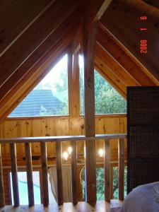 a room with a large window in a cabin at Log Villa in Cape Town