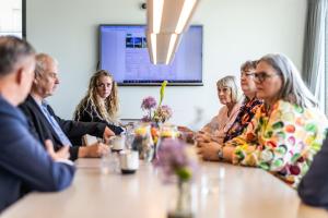 a group of people sitting around a table at Airport Hotel, Billund in Billund