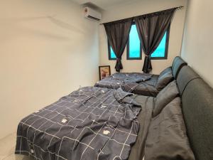 Postel nebo postele na pokoji v ubytování Sky Suite Meritus Residence in Perai