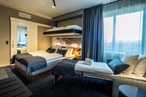 a hotel room with two beds and a window at Airport Hotel, Billund in Billund