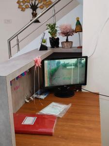a computer monitor sitting on top of a wooden floor at Shri Resort & Lodging in Alta +28 photos