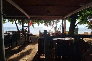 a restaurant on the beach with a view of the ocean at Breizh Cape Beach Bungalows in Ko Lanta