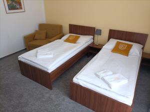 Postel nebo postele na pokoji v ubytování Hotel Eminent