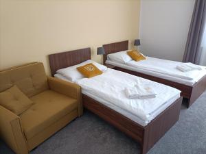 Postel nebo postele na pokoji v ubytování Hotel Eminent