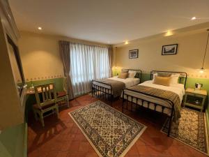 Postel nebo postele na pokoji v ubytování Seto Ghar Hotel + 37 fotografií