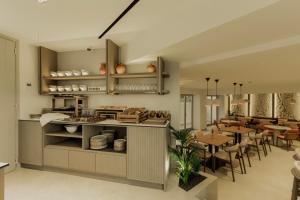 a kitchen and dining room with a table and chairs at Opal Paros in Naousa