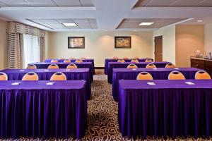 a conference room with purple tables and chairs at Holiday Inn Express & Suites Chattanooga-Hixson by IHG in Hixson +37 photos