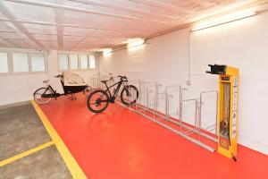 two bikes in a gym with a bike rack at Hotel la Palma au Lac in Locarno
