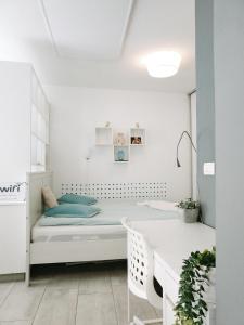 a bedroom with a bed and a desk at Apartment Astina in Koper