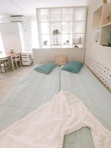 a bedroom with two beds with a blanket on the floor at Apartment Astina in Koper +7 photos