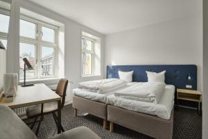 Postelja oz. postelje v sobi nastanitve Hotel Garni