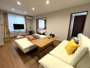 TV a/nebo společenská místnost v ubytování Peaks Home101