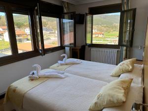 Ein Bett oder Betten in einem Zimmer der Unterkunft Casa Blanco Conde