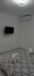 Postel nebo postele na pokoji v ubytování Casa Niko