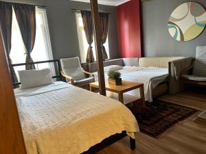 A bed or beds in a room at Ahmet Efendi Evi