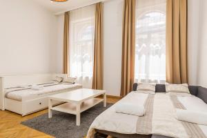 Posteľ alebo postele v izbe v ubytovaní Real Apartments Révay