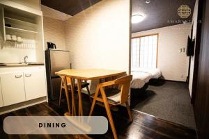 a room with a table and a kitchen with a bed at Hotel Amaranth Kyoto Gojo - Vacation STAY 19846v in Kyoto