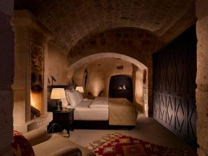 A bed or beds in a room at Argos in Cappadocia