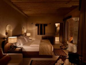 A bed or beds in a room at Argos in Cappadocia