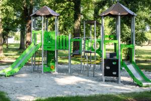 a group of playground equipment in a park at Geszt, Tisza-kastély, Arany János Vendégház és Étterem in Geszt