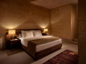 A bed or beds in a room at Argos in Cappadocia