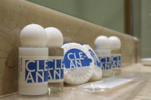 a group of three bottles of cleaning products on a counter at TRYP by Wyndham Porto Expo Hotel in Leça da Palmeira