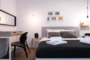 a bedroom with a bed and a desk and a chair at Beachfront Villa Taris with Seaview in Privlaka +28 photos