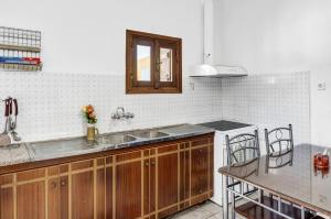 a kitchen with a sink and a counter top at Villa Houvarda in Olympos
