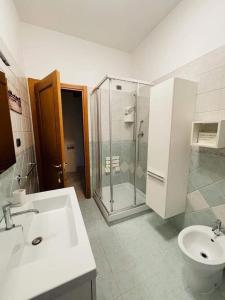a bathroom with a sink and a shower and a toilet at Mare e dintorni in San Benedetto del Tronto +34 photos