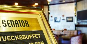 a sign in a restaurant that says sekerkerutics buffet at Hotel Senator Hamburg in Hamburg
