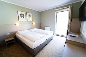 Posteľ alebo postele v izbe v ubytovaní motel22 Parkplatz inklusive