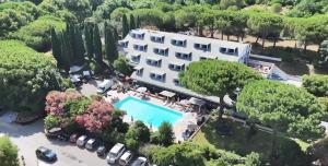 an aerial view of a building with a pool at PFA Hotel La Darsena - Follonica in Puntone di Scarlino +33 photos