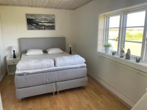 Postel nebo postele na pokoji v ubytování Kapelludden Östra Öland