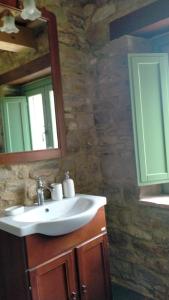 a bathroom with a sink and a mirror at Villa Incanto in Apiro
