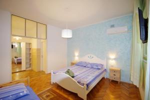 Postel nebo postele na pokoji v ubytování Apartman Gortanova uvala