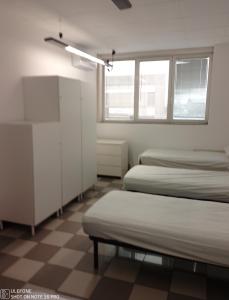 Postel nebo postele na pokoji v ubytování Appartamento per 6 Lavoratori