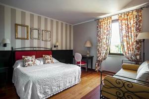 A bed or beds in a room at San Giovanni Terme Rapolano