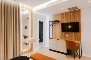TV a/nebo společenská místnost v ubytování Hotel Olsi