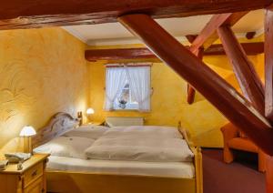 Postel nebo postele na pokoji v ubytování Hotel Gut Voigtlaender
