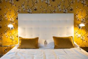 Ein Bett oder Betten in einem Zimmer der Unterkunft Hotel Ottheinrich
