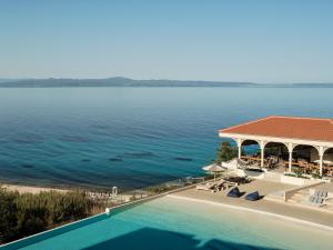 an aerial view of a resort with a swimming pool at Cora Hotel & Spa in Afitos